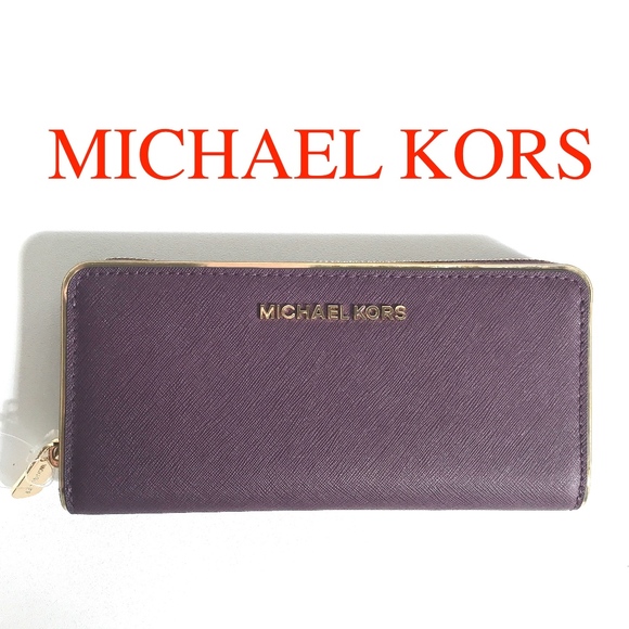 Michael Kors Handbags - Michael Kors Leather wallet Damson Zipper Clutch